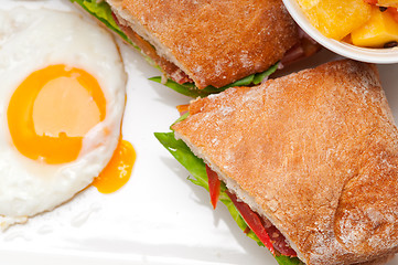 Image showing ciabatta panini sandwich eggs tomato lettuce