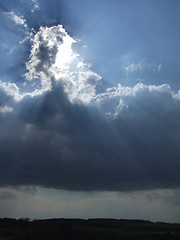 Image showing White clouds and sun rays