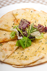 Image showing garlic pita bread pizza with salad on top