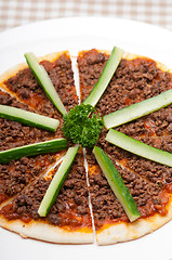 Image showing Turkish beef pizza with cucumber on top