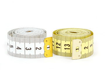 Image showing Yellow and white measuring tape isolated on white