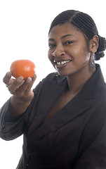 Image showing woman holding tangerine