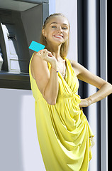 Image showing Happy woman with plastic card