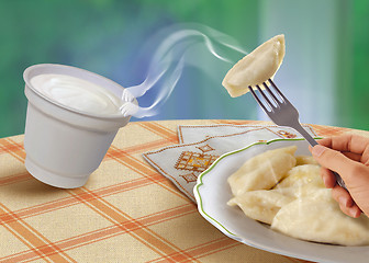 Image showing vareniks and sour cream