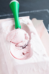 Image showing Strawberry ice cream and scoop