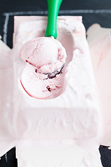 Image showing Strawberry ice cream and scoop