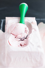 Image showing Strawberry ice cream and scoop