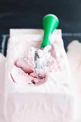 Image showing Strawberry ice cream and scoop