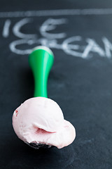 Image showing Strawberry ice cream and scoop