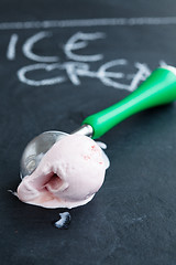 Image showing Strawberry ice cream and scoop