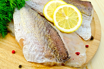 Image showing Fillet of codfish on a round board