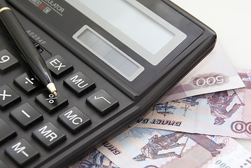 Image showing Calculator, money and black pen