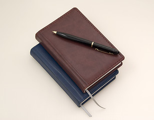 Image showing Fine diaries and black pen 