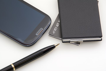 Image showing Phone, cards, pen. Everything of black colour