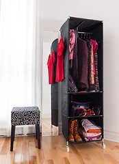 Image showing Mobile wardrobe with clothing and shoes