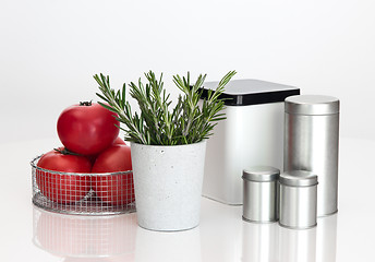 Image showing Food storage containers, tomatoes and rosemary