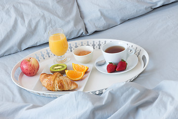 Image showing Tray with healthy breakfast on a bed