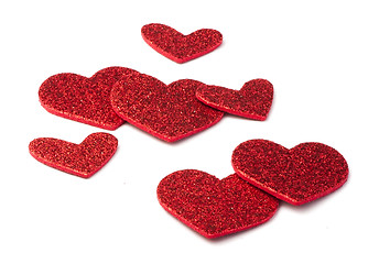 Image showing Red shiny hearts on white background