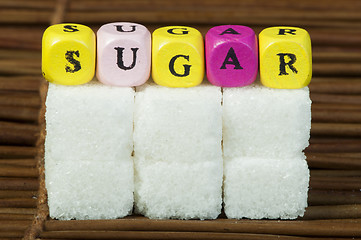 Image showing Sugar lumps and text