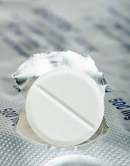 Image showing White pill in a pack very close up