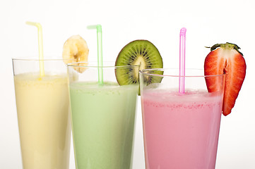 Image showing Banana, kiwi and strawberry milk shake and fresh fruis