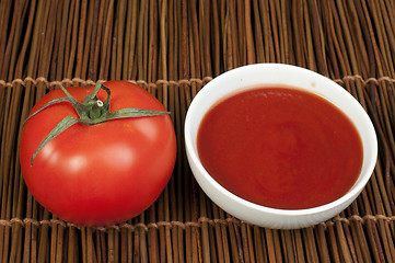 Image showing Tomato and Bowl of tomato sauce