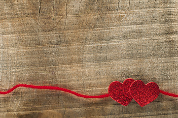 Image showing Red ribbon tape and two hearts