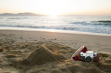 Image showing Vintage camera on the beach