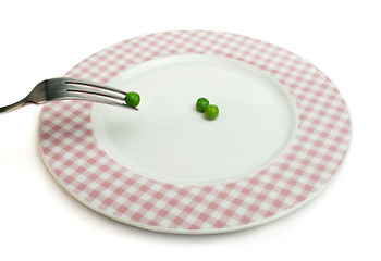 Image showing Plate with peas and centimeter measure