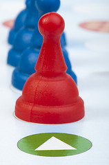 Image showing Red and blue game pawns white isolated