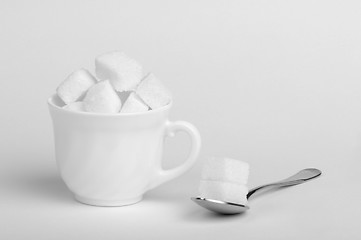 Image showing Sugar lumps in cup