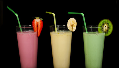 Image showing Banana, kiwi and strawberry milk shake and fresh fruis