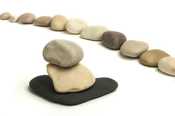 Image showing Stacked stones white isolated