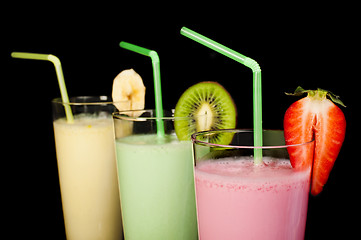 Image showing Banana, kiwi and strawberry milk shake and fresh fruis