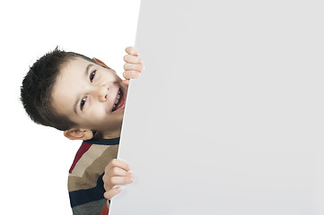 Image showing Little boy holding a whiteboard