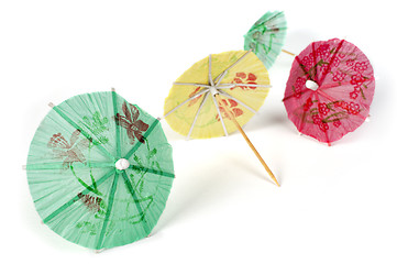 Image showing Colorful cocktail umbrellas white isolated