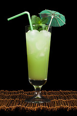 Image showing Green cocktail with cubes ice