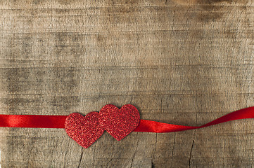 Image showing Red ribbon tape and two hearts