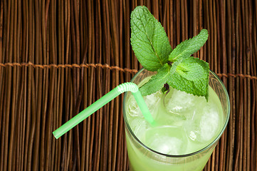 Image showing Green cocktail with cubes ice