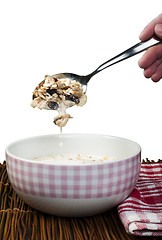 Image showing Muesli breakfast in a bow and spoon