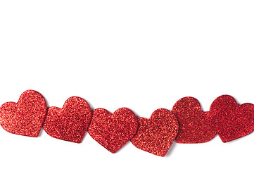 Image showing Red shiny hearts on white background