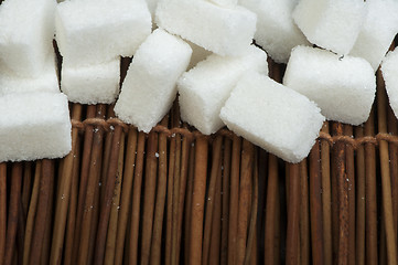 Image showing Sugar lumps on wooden base