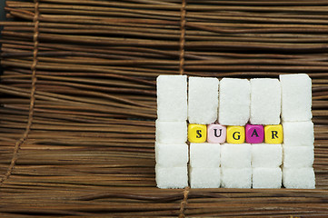 Image showing Sugar lumps and text