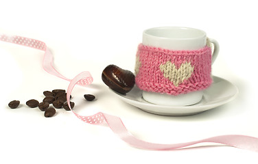 Image showing Cup of coffee with knitted heart symbol