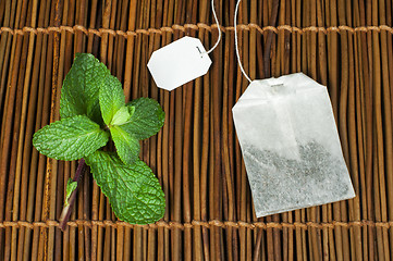 Image showing Tea bag and fresh mint