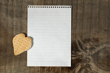 Image showing Heart shape cookie on wooden background