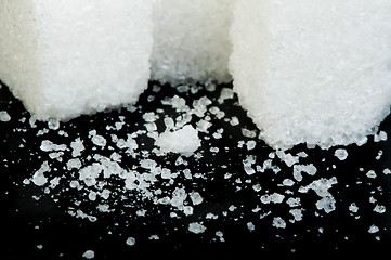 Image showing Sugar lumps black isolated