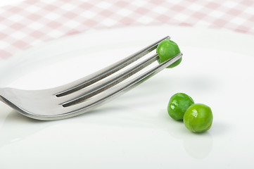 Image showing Plate with peas and centimeter measure