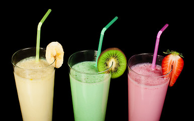 Image showing Banana, kiwi and strawberry milk shake and fresh fruis