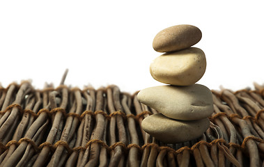 Image showing Stacked stones on wooden base